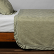 King-sized Bella Notte Marisette Bedspread in soft cloud color, showcasing elegant, lightweight bedding with intricate stitching.