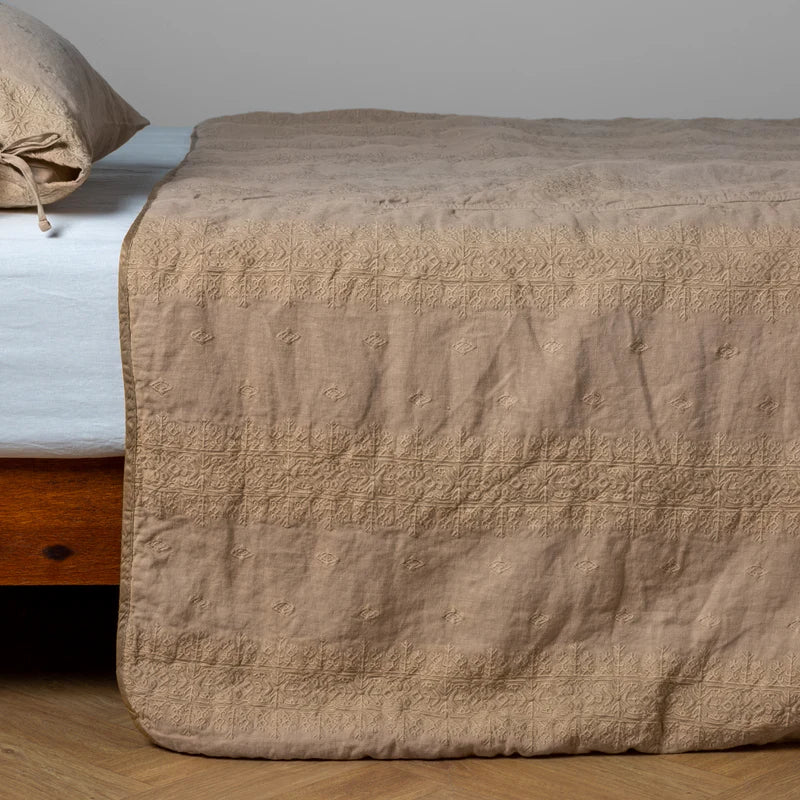 White Bella Notte Ines bedspread on a king-sized bed, showcasing soft, luxurious fabric and elegant design.