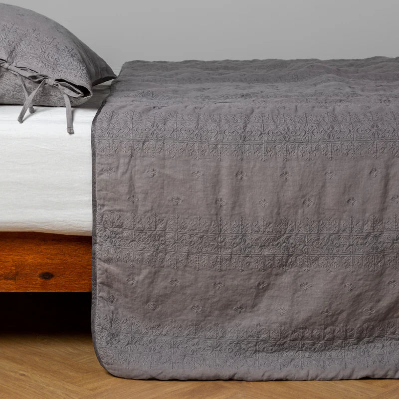 White Bella Notte Ines bedspread displayed on a king-sized bed, showcasing soft fabric and elegant design details.