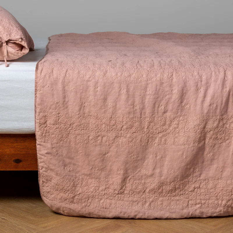 White Bella Notte Ines Bedspread spread evenly across a king-size bed, showcasing soft, luxurious fabric and elegant design.