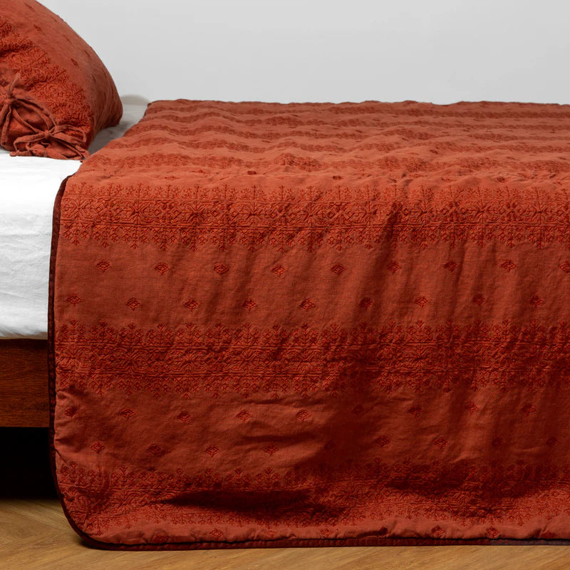 White Bella Notte Ines Bedspread displayed on a king-sized bed with a soft, luxurious fabric and elegant design.