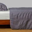 White Bella Notte Ines Bedspread spread over a king-size bed, showcasing soft fabric and elegant design.