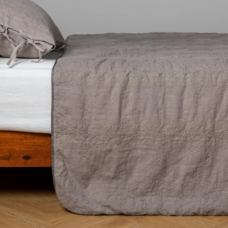White Bella Notte Ines Bedspread on a king-size bed, showcasing soft, luxurious fabric with elegant stitching details.