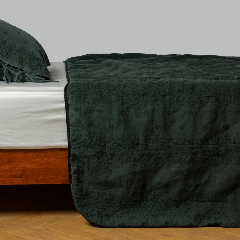 White Bella Notte Ines Bedspread spread evenly on a king-sized bed, showcasing soft luxurious fabric and elegant design.