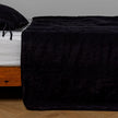 White Bella Notte Ines Bedspread spread evenly on a bed, showcasing its soft fabric and elegant design for king size bedding.