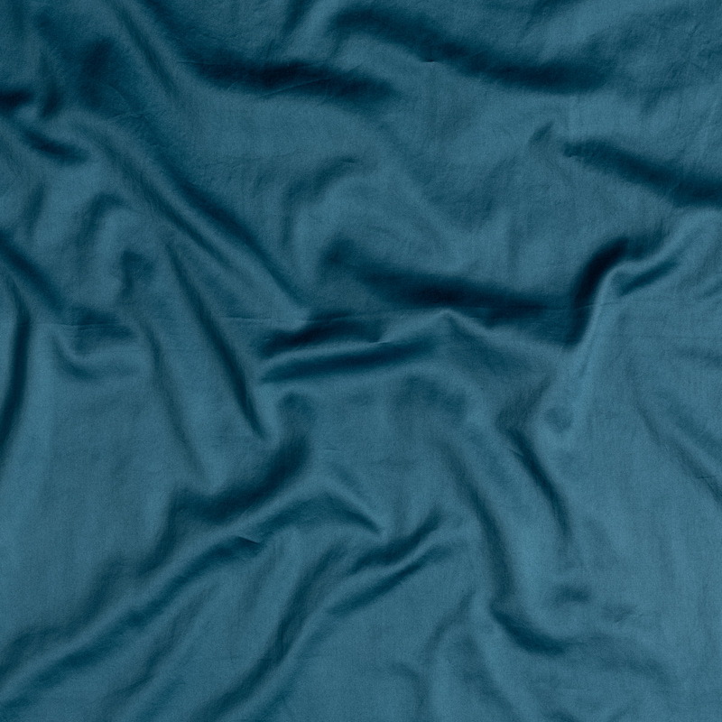 Bella Notte Bria duvet cover in Cenote fabric, showcasing soft, luxurious bedding with intricate stitching and elegant design.