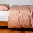Bella Notte Bria duvet cover in Cenote fabric, showcasing elegant, soft-textured bedding with intricate stitching details.