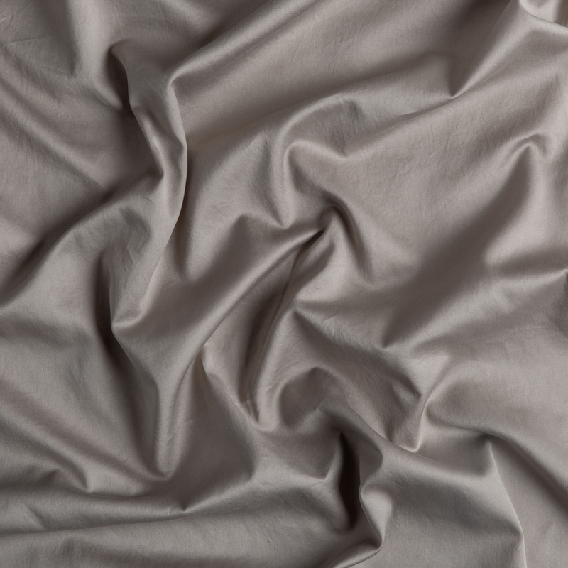 Bella Notte Bria duvet cover in soft, luxurious fabric with a subtle textured pattern, shown on a neatly made bed.