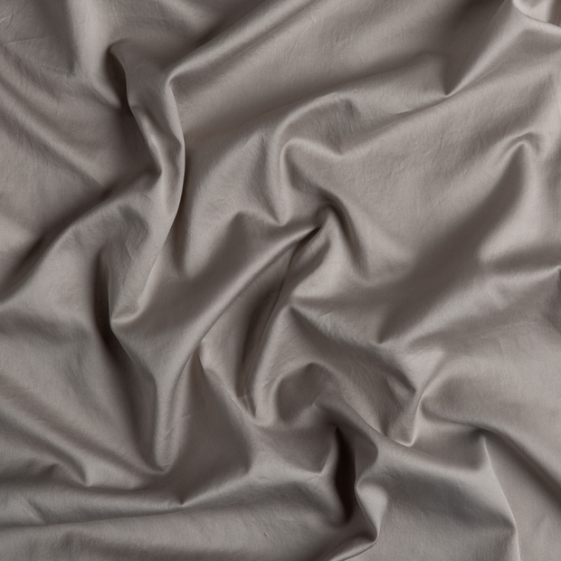 Bella Notte Bria duvet cover in soft, luxurious fabric with a subtle textured pattern, shown on a neatly made bed.