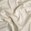 Bella Notte Bria duvet cover in Cenote fabric, showcasing elegant, textured bedding with a soft, luxurious appearance.