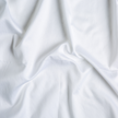 Bella Notte Bria Duvet Cover in Cenote fabric, showcasing elegant, soft-textured bedding with intricate detailing.