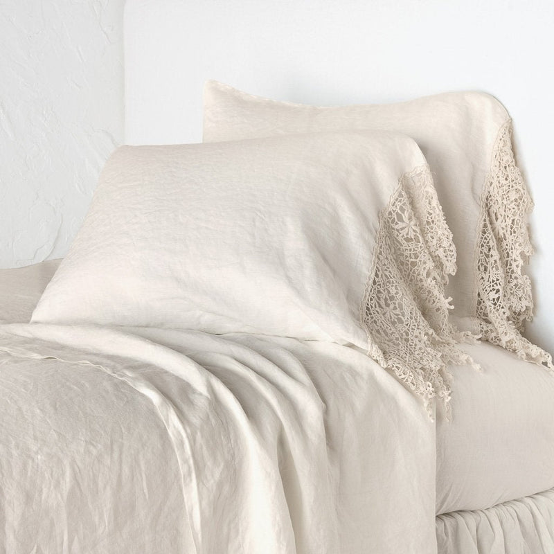 King-sized linen pillowcase by Bella Notte with elegant Frida lace trim, showcasing soft, textured fabric and intricate lace details.