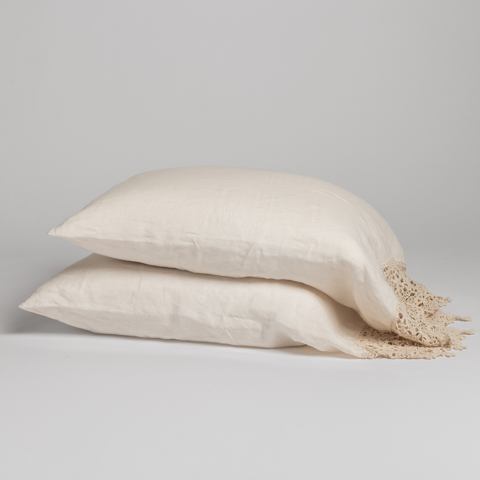 Natural linen pillowcase with intricate Frida lace detail by Bella Notte, showcasing soft fabric and elegant craftsmanship.