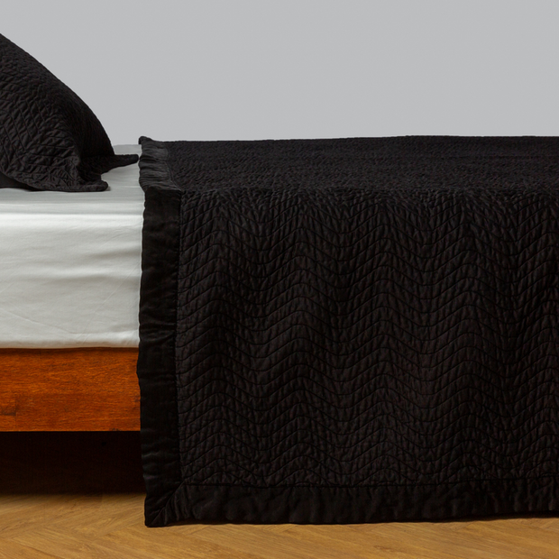 Bella Notte Cirillo Coverlet in autumn colors, showcasing soft fabric and elegant design for king-sized bedding.