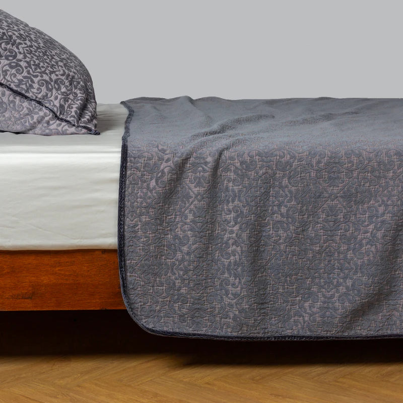 Bella Notte Vienna coverlet in autumn colors, showing a cozy, textured fabric on a king-sized bed.