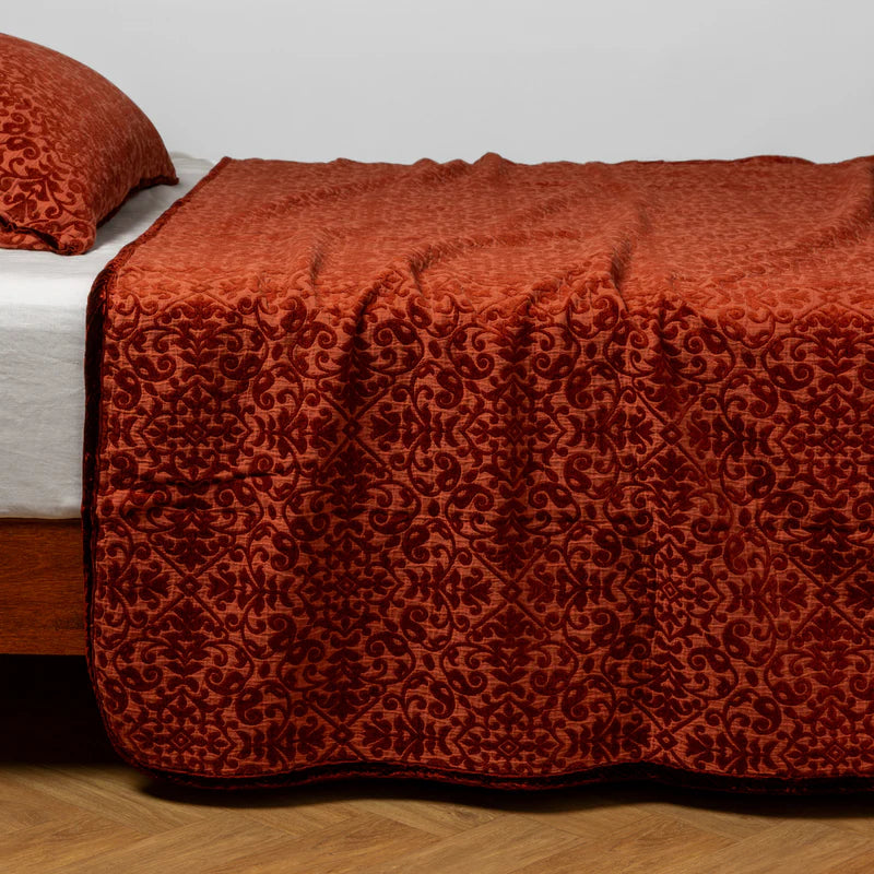 Bella Notte Vienna coverlet in autumn tones, showcasing soft fabric and elegant design on a bed.