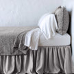 Bella Notte Vienna coverlet in autumn colors, showcasing its soft fabric and elegant design on a bed.