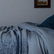 Bella Notte Vienna coverlet in autumn colors, showcasing soft fabric and elegant design on a bed.