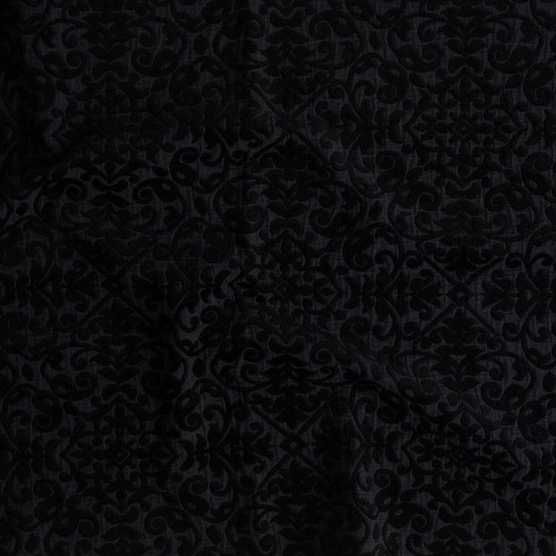 Bella Notte Vienna Coverlet on a bed, showcasing its soft, textured fabric in an elegant autumn color for king-sized bedding.