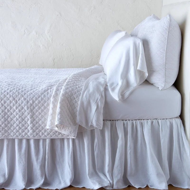 Bella Notte silk velvet quilted coverlet in warm autumn tones, lightweight and luxuriously soft twin-sized bedding.