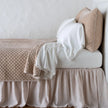 Bella Notte Silk Velvet Quilted Coverlet on a bed, showcasing its plush, luxurious fabric and elegant quilted design.