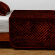 Bella Notte silk velvet quilted coverlet in autumn colors, twin size, featuring luxurious, soft quilted fabric with elegant stitching.