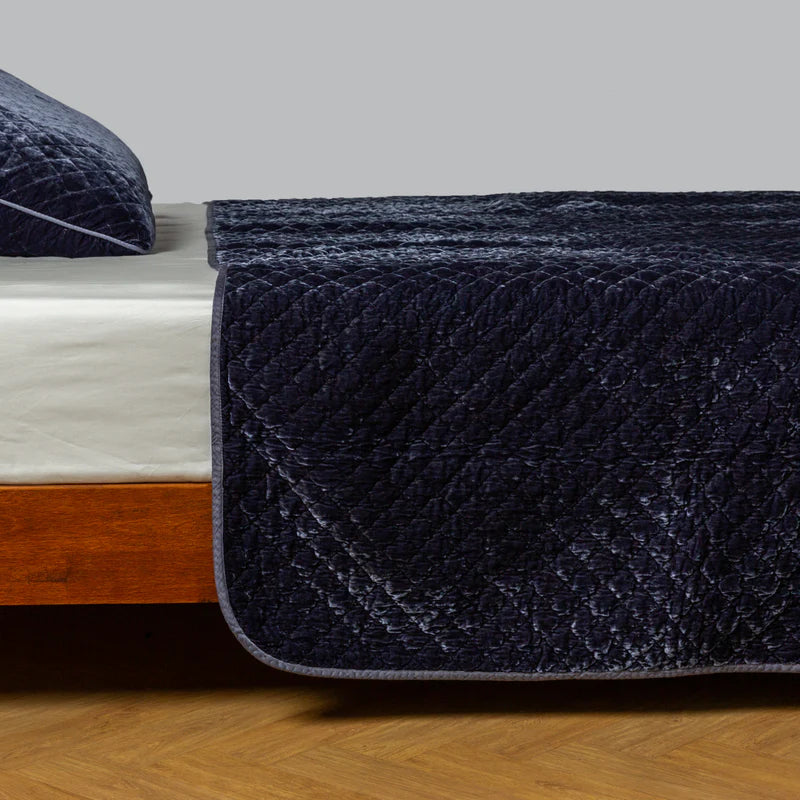 Bella Notte silk velvet quilted coverlet in autumn tones, twin size, showcasing its luxurious, textured quilted design.