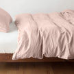 Bella Notte Austin duvet cover in Cenote fabric, shown on a bed with soft, luxurious bedding and elegant design.