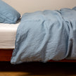 Bella Notte Austin duvet cover in Cenote fabric, showcasing elegant textile pattern on a king-sized bed.