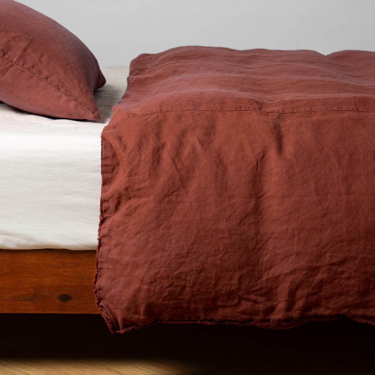 Bella Notte Austin duvet cover in soft autumn-toned fabric with a subtle pattern, shown on a bed.