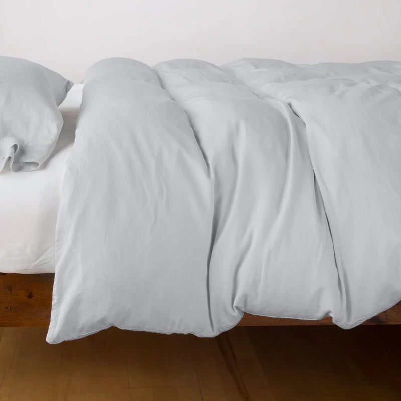 Bella Notte Madera Luxe duvet cover in cloud color, showcasing soft fabric and elegant design on a king-sized bed.