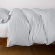 Bella Notte Madera Luxe duvet cover in cloud color, showcasing soft fabric and elegant design on a king-sized bed.