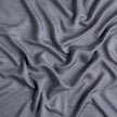 Bella Notte Madera Luxe duvet cover in cloud color, king size, showing soft fabric with elegant texture and stitching details.