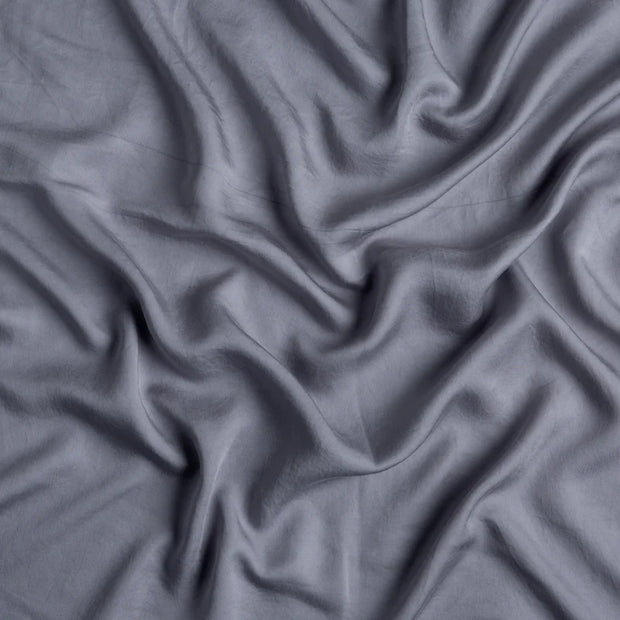 Bella Notte Madera Luxe duvet cover in cloud color, king size, showing soft fabric with elegant texture and stitching details.