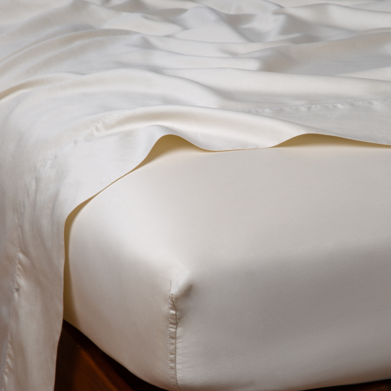 Bella Notte Bria fitted sheet in Cenote fabric, California king size, showing smooth, soft textile with neat corner edges.