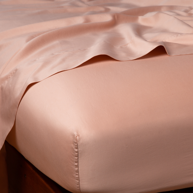 Bella Notte Cenote Cal King Bria Fitted Sheet in soft, luxurious fabric, shown on a bed with smooth, neatly fitted corners.