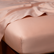 Bella Notte Cenote Cal King Bria fitted sheet in soft, luxurious fabric showing smooth, fitted design on a bed.