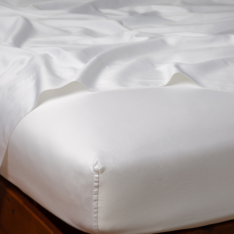 Bella Notte Bria fitted sheet in Cenote fabric for California king bed, showcasing soft, luxurious bedding with a smooth fit.