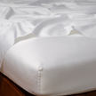 Bella Notte Bria fitted sheet in Cenote fabric for California king bed, showcasing soft, luxurious bedding with a smooth fit.
