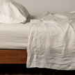 Natural linen flat sheet by Bella Notte, showcasing soft, breathable fabric with a smooth, flat surface in a neutral color.