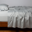 Bella Notte Cenote King Bria Flat Sheet in soft fabric, neatly spread showing smooth, luxurious bedding texture.