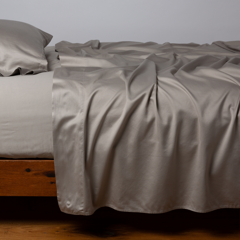 Bella Notte Cenote king flat sheet showing smooth, soft white cotton fabric with subtle texture and elegant stitching details.