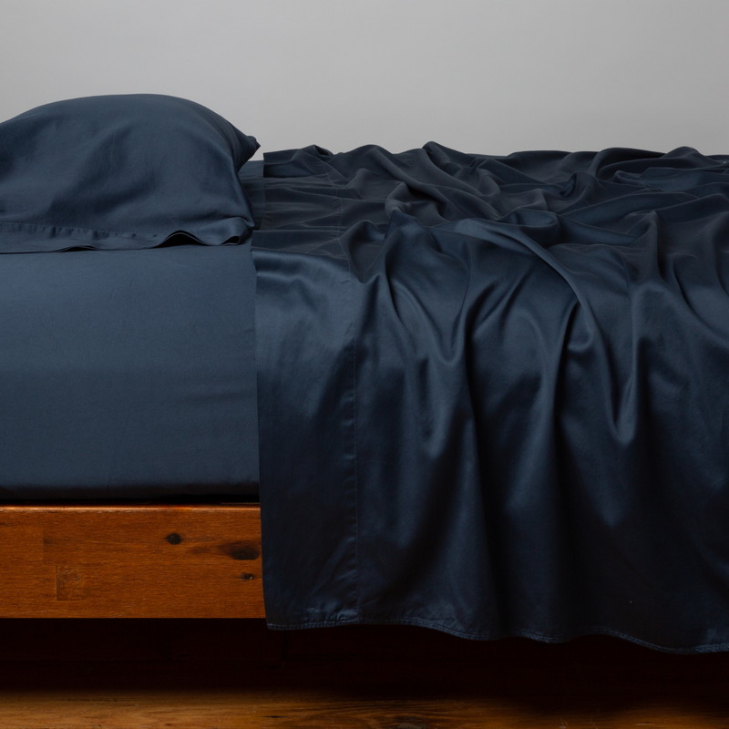 Bella Notte Cenote King Bria Flat Sheet displayed on a bed with soft, luxurious fabric and elegant design.