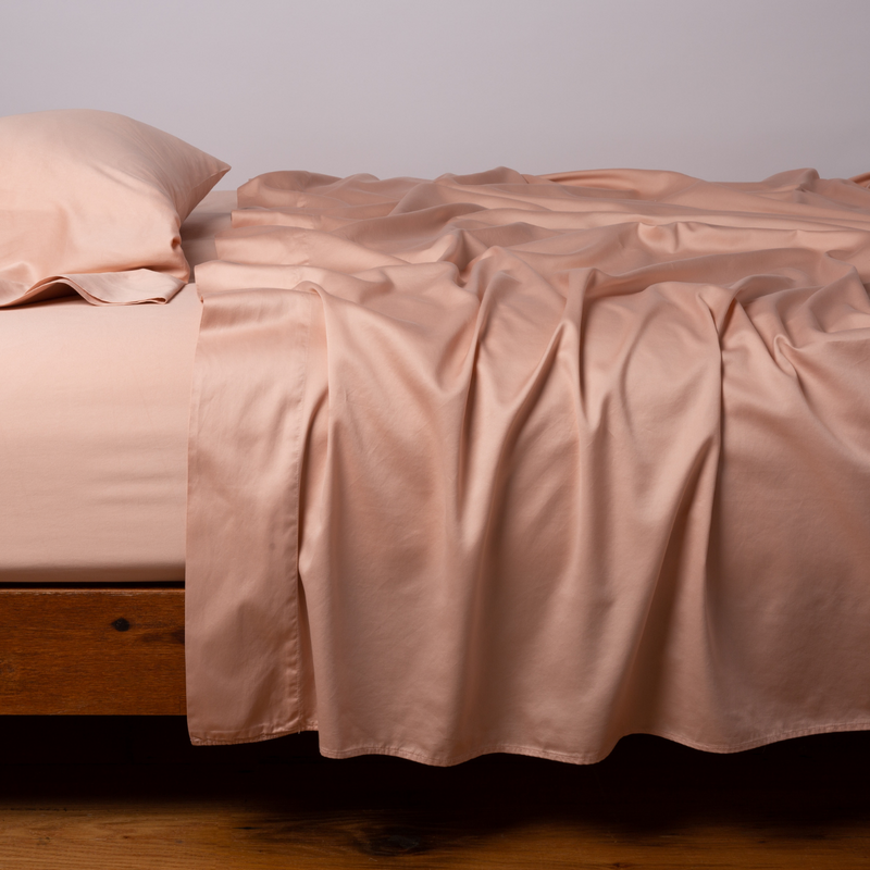 Bella Notte Cenote King Bria Flat Sheet in soft, luxurious fabric, neatly folded with subtle texture visible.