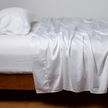 Bella Notte Cenote King Bria Flat Sheet in soft, luxurious fabric laid flat showing smooth, elegant design.