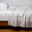 Bella Notte Cenote King Bria Flat Sheet laid flat, showcasing soft, elegant fabric and detailed stitching for a luxurious bedroom look.