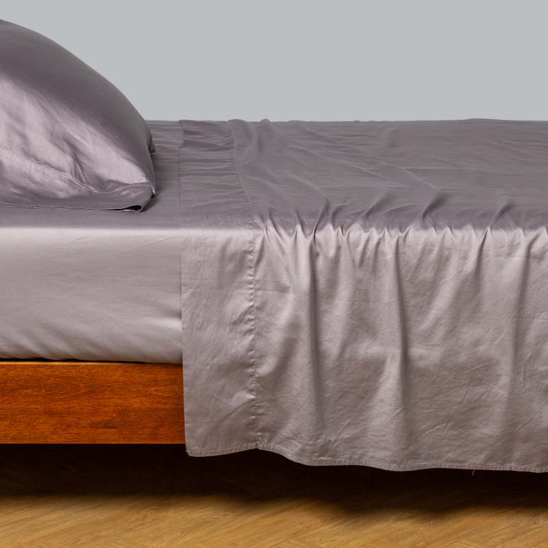 Bella Notte Cenote King Bria Flat Sheet in soft, luxurious fabric, neatly spread on a bed with a subtle textured pattern.