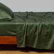 Bella Notte Cenote king flat sheet with soft, smooth fabric and elegant design, displayed on a bed.