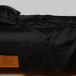 Bella Notte Cenote King Bria Flat Sheet spread out on a bed, showcasing soft, luxurious fabric and elegant design.
