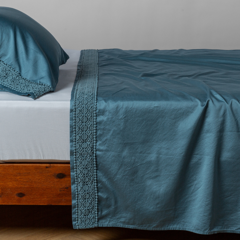 Bella Notte Bria flat sheet in Cenote with Novola lace, showcasing soft fabric and elegant lace detail for king size bedding.